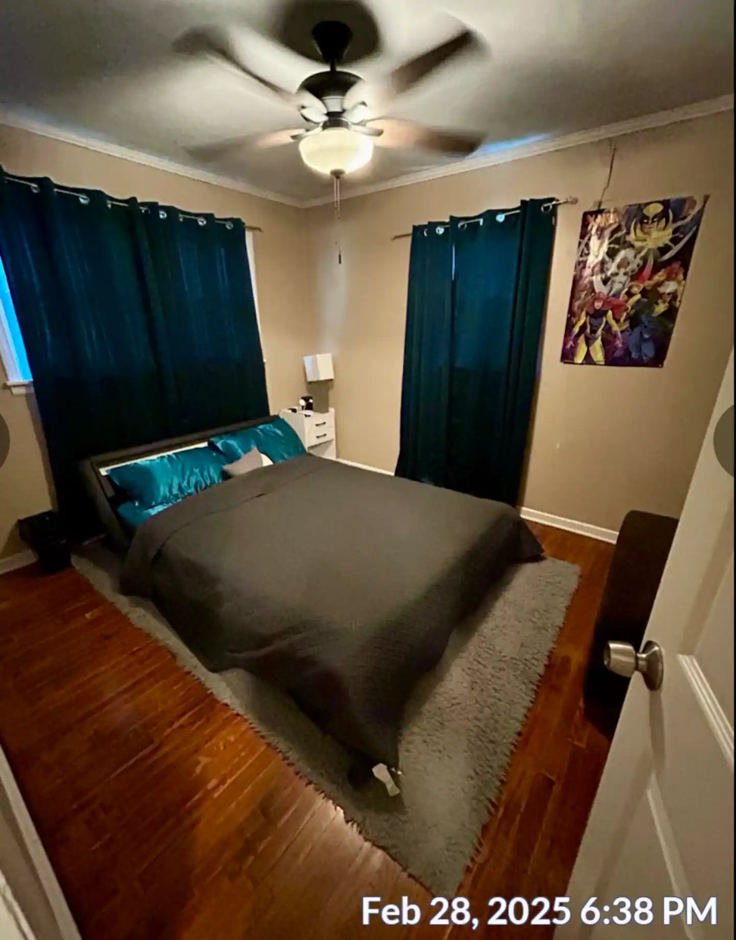 Queen bedroom with teal accents